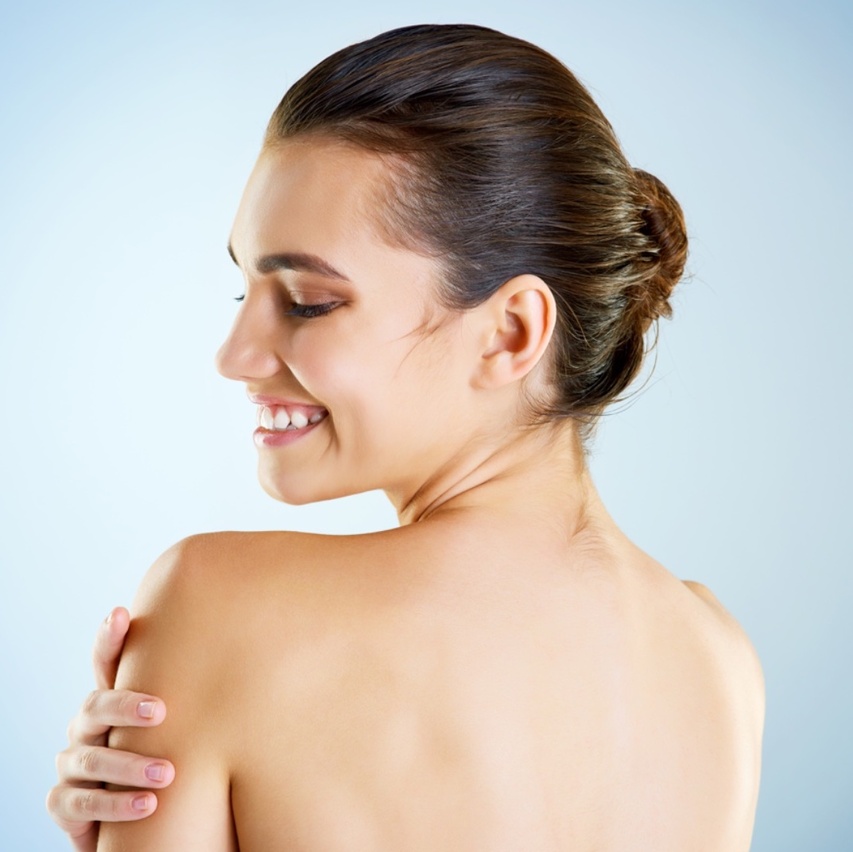 Woman treat her body acne