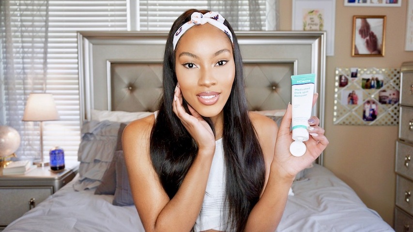 Woman using MDacne Medicated Dark Spot Remover to treat post-acne hyperpigmentation