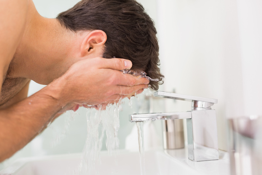 Man cleansing skin with mild MDacne cleanser with 2% salicylic acid