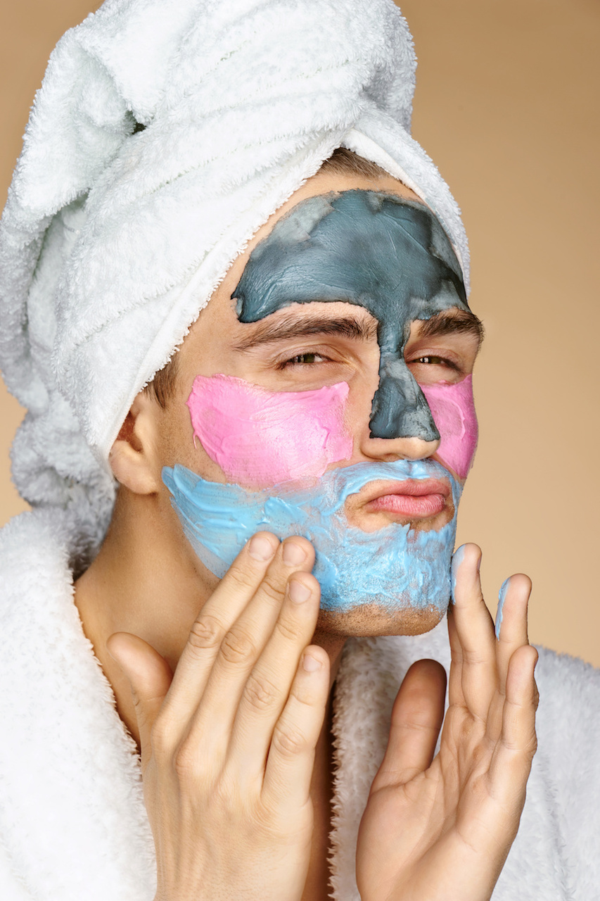 Man wearing 3 different types of face masks for acne treatment