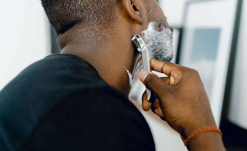 Man shaving with MDacne Soothing Shave Cream