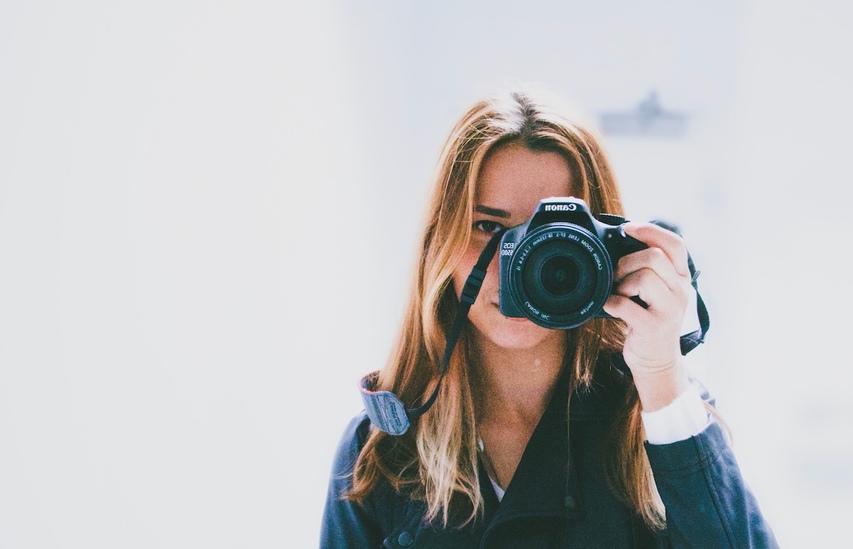 Girl taking picture of acne